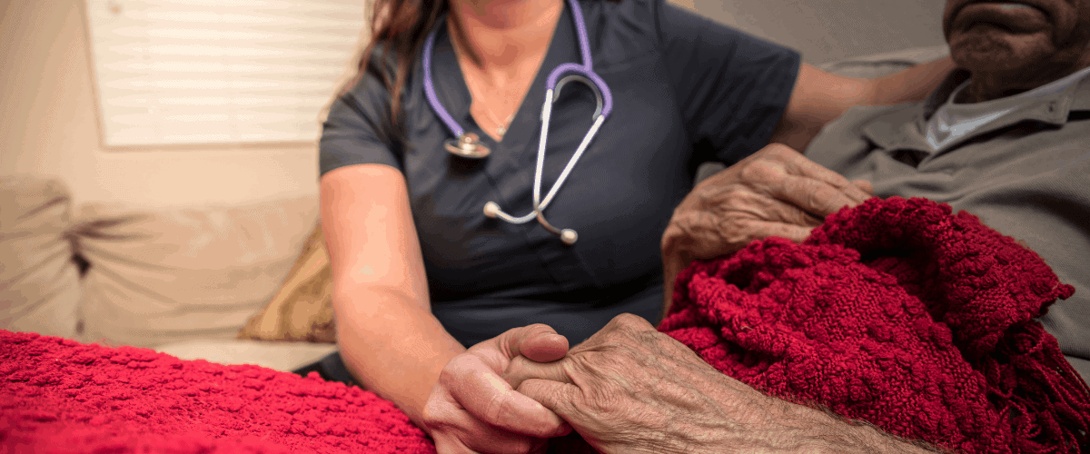 woman comforted in hospice care